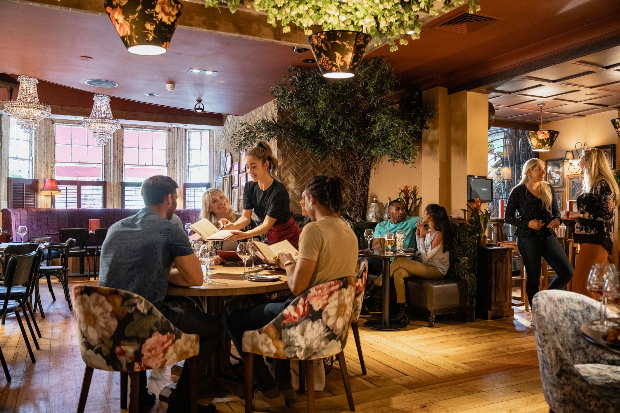 Guests enjoying an upscale dining and lounge setting