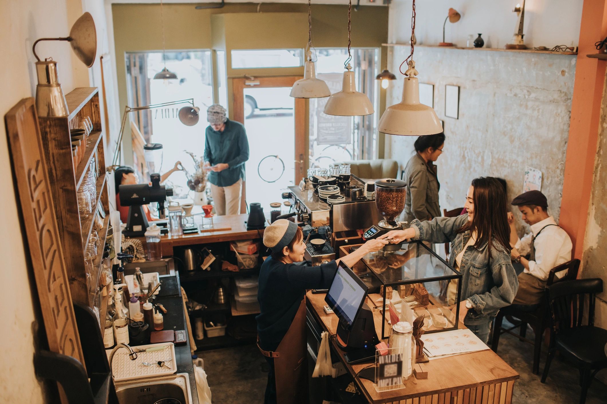 Service moment inside a warm hospitality space