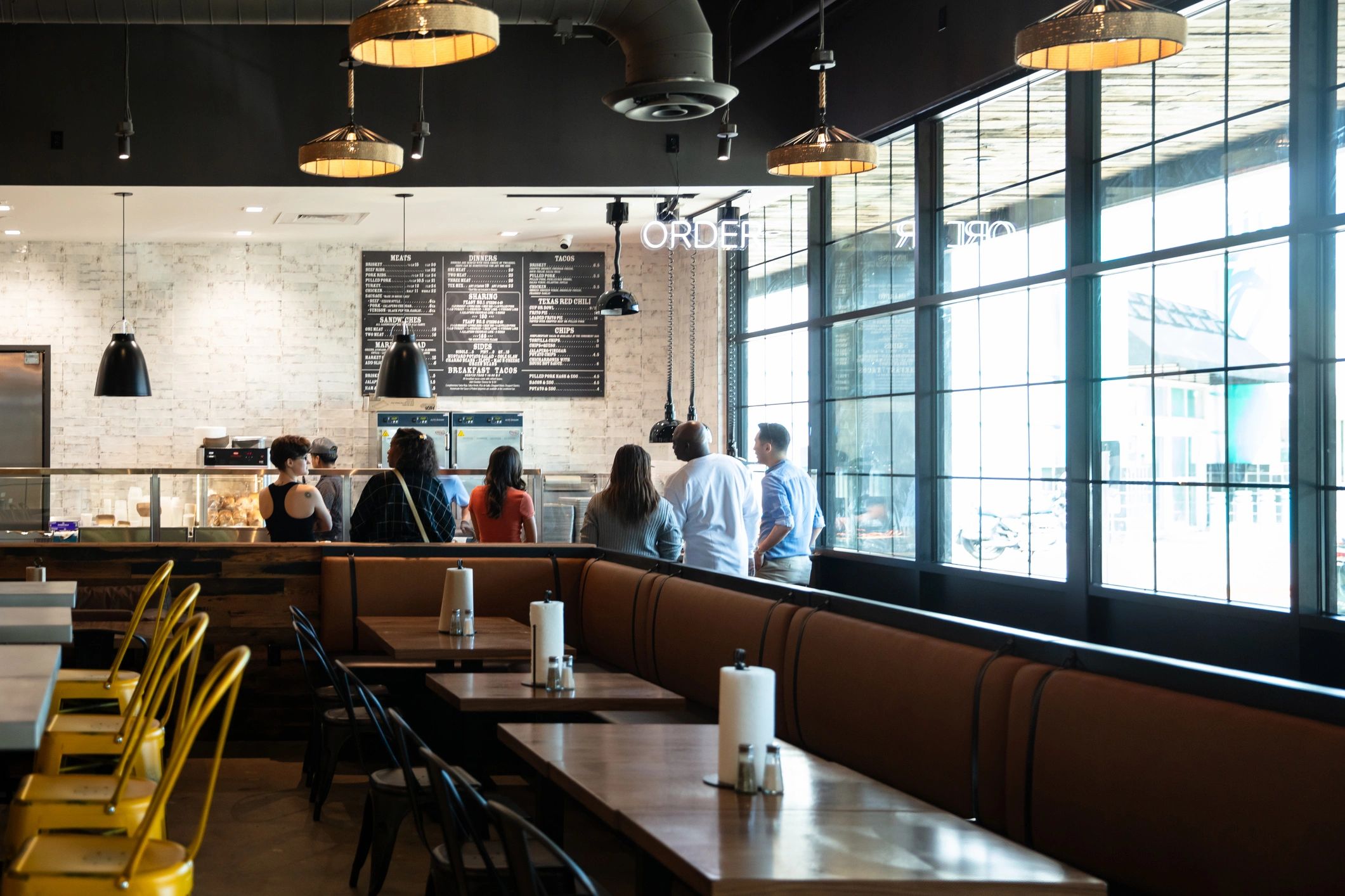 Patrons gathered in a lively food and drink venue