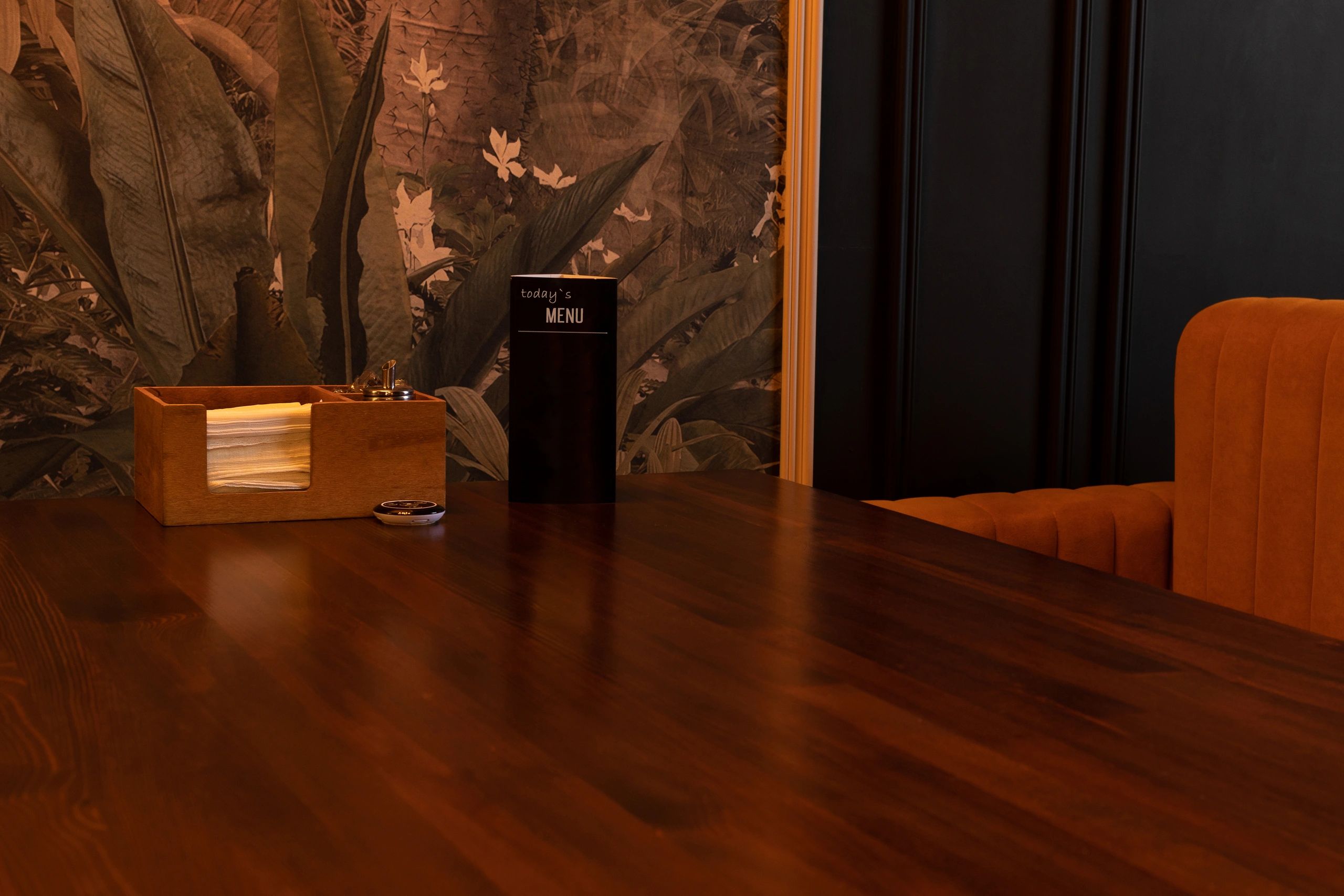 Warm lounge table with drinks in a dim upscale setting
