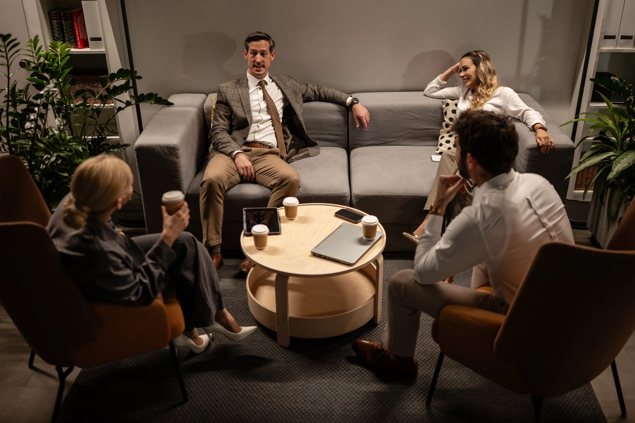 People in conversation in a lounge-style setting